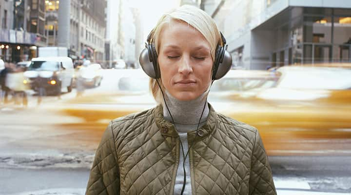 Woman using ashwagandha and focusing while on a busy street