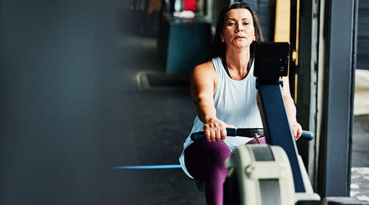 Woman working out on rowing machine