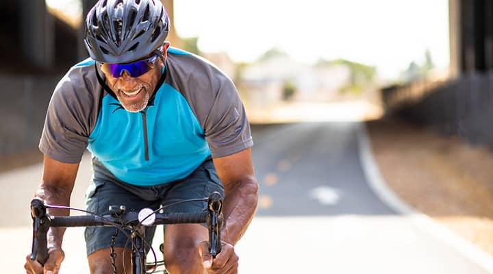 Man biking to improve his heart health