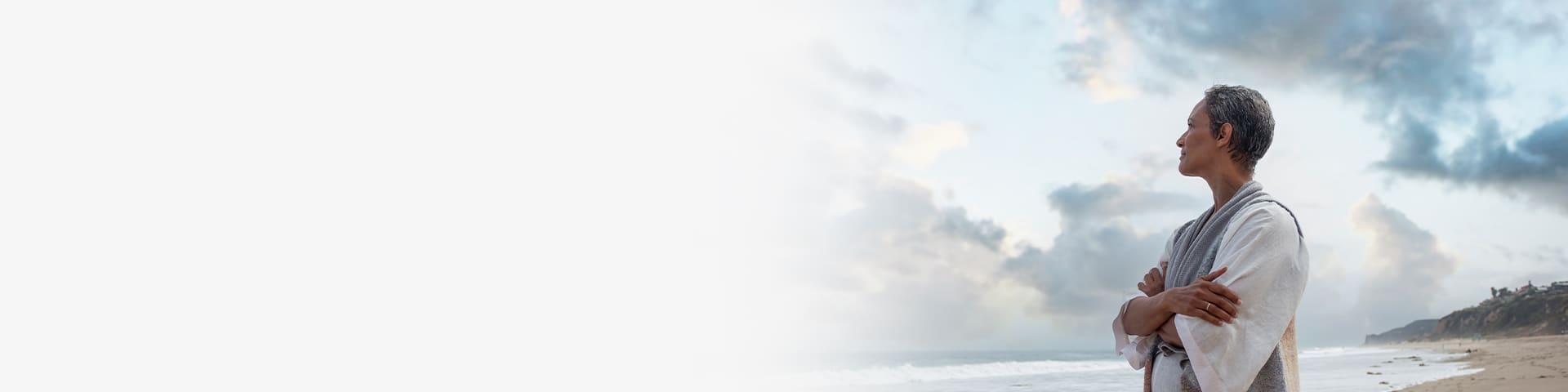 Woman on the beach thinking about life after menopause