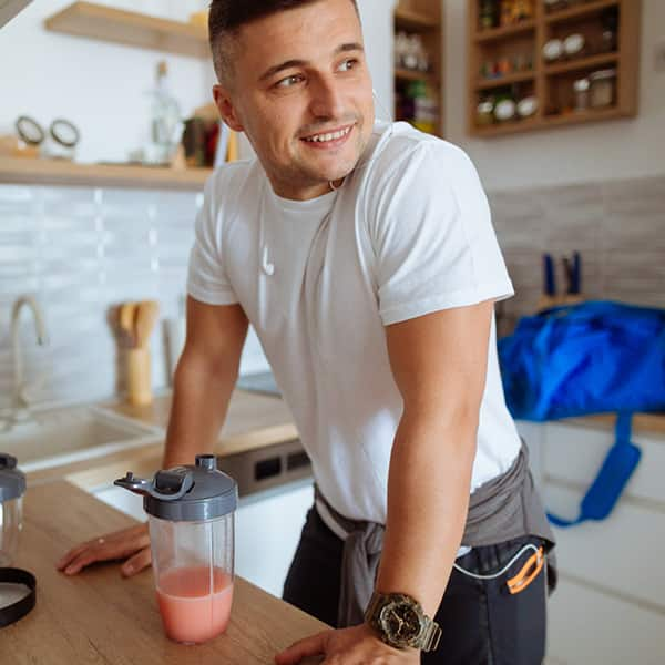 Man drinking a recovery workout shake