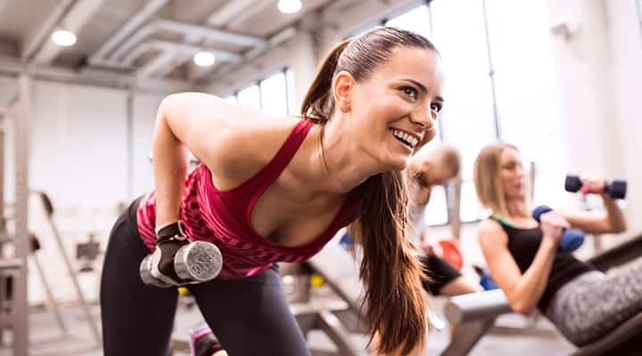 Women doing various free weight training